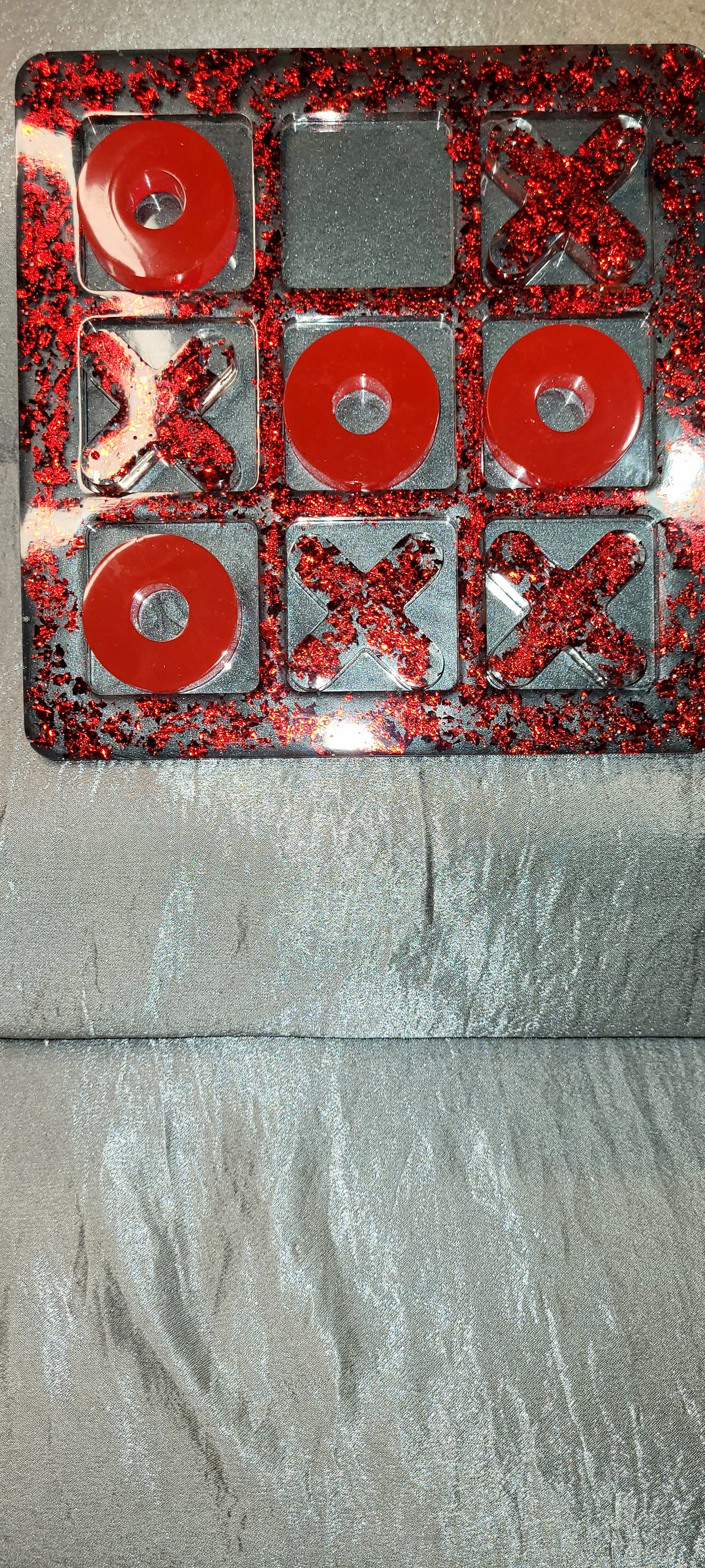 Red and Grey Tic Tac Toe Board